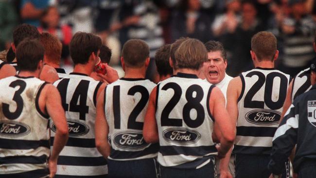 Geelong coach Gary Ayres talks to his players at three-quarter-time before the Cats Collingwood by three points 1999.