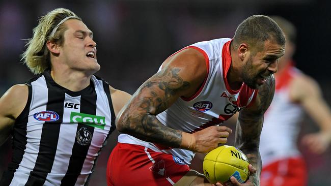 Darcy Moore pursues Swans champ Lance Franklin. Pic: AAP