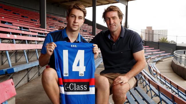 Rhylee West with his dad Scott and his new No.14 jumper. Picture: AFL Media