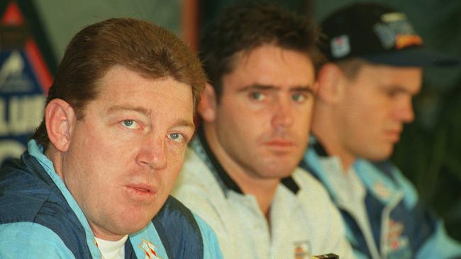 Phil Gould speaks to the media as Blues captain Brad Fittler looks on in 1996.