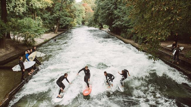 Mick Fanning is seen surfing the Eisbach, a man-made river that generates a permanent wave in the English Gardens in Munich, Germany on September 29, 2017. Photo: Cory Wilson/Red Bull