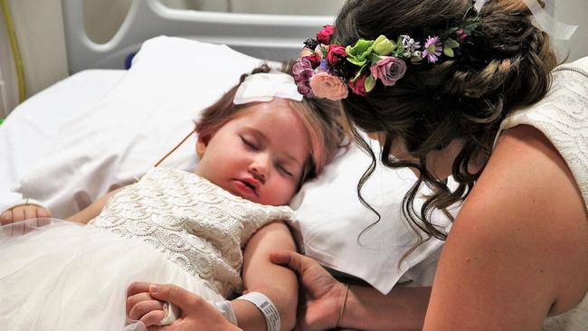 Paige Skarratts with mum Tania on the day of her parents’ wedding at Lady Cliento Children’s Hospital.