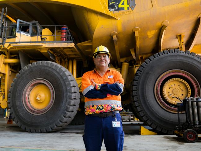 BHP Minerals Australia President Edgar Basto in front of a Komatsu haul truck at Goonyella Riverside Mine.