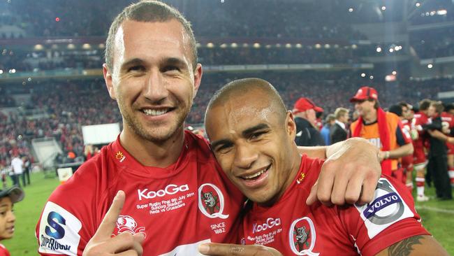 Cooper and Genia celebrate their title success with the Reds in 2011.