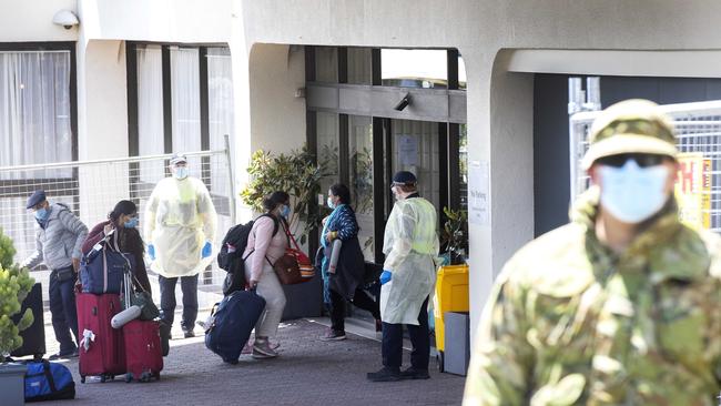 Travellers arrive at Hobart's Best Western Hotel after a repatriation flight from India arrived at Hobart. Picture Chris Kidd