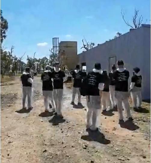 Animal activists storm a Millmerran feedlot and dairy wearing shirts that say "meat the victim". Picture: contributed