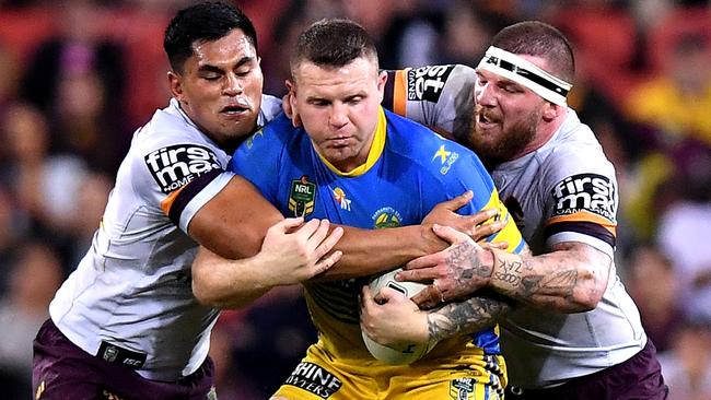 Nathan Brown is wrapped up by the Brisbane defence. Picture: Getty Images