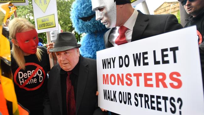 Vivian Frederick Deboo is confronted by B, right, and his supporters outside court in November 2018. Picture: David Mariuz