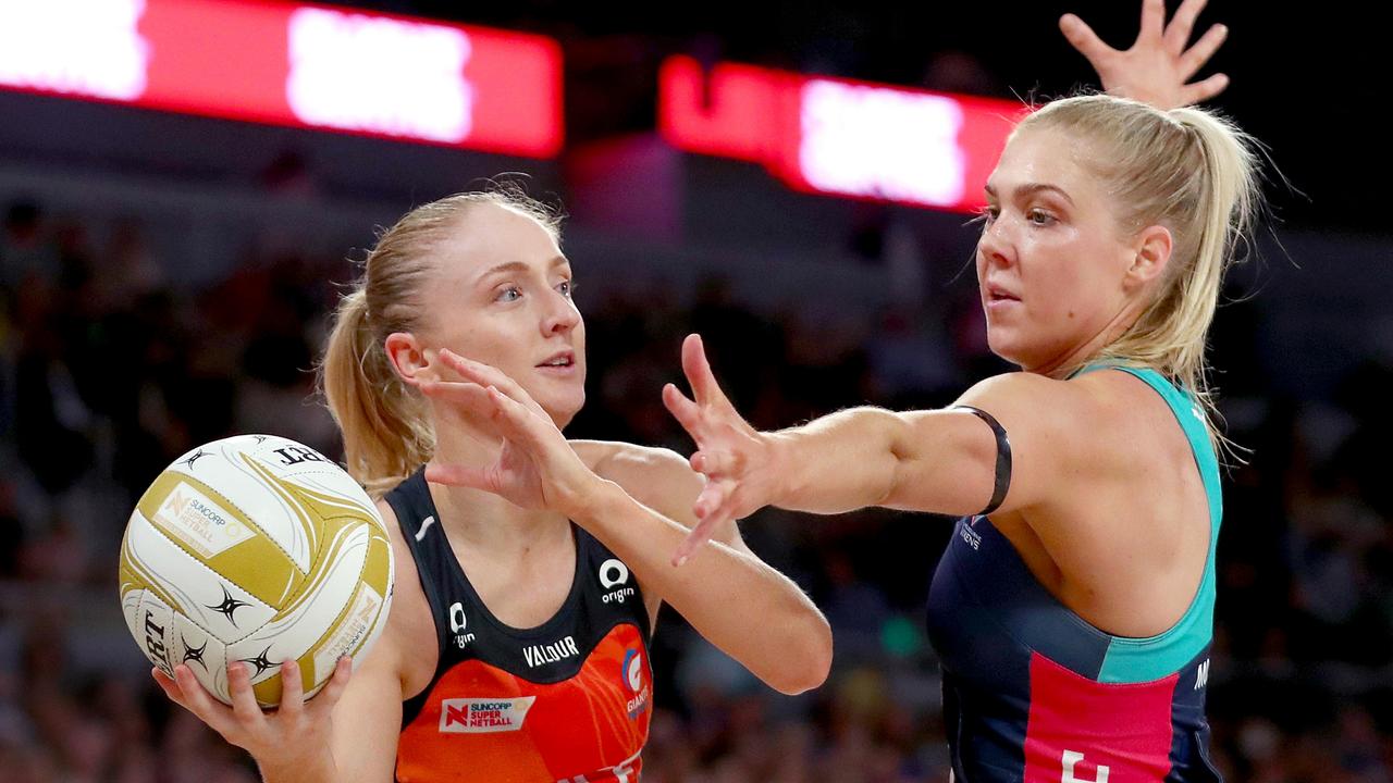 Maddie Hay passes against Kate Moloney during the see-sawing contest. Picture: Kelly Defina/Getty Images