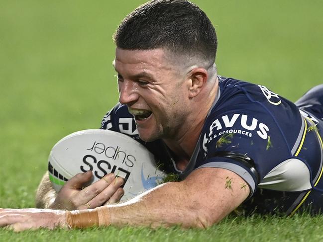 TOWNSVILLE, AUSTRALIA - AUGUST 19:  Chad Townsend of the Cowboys scores a try during the round 23 NRL match between the North Queensland Cowboys and the New Zealand Warriors at Qld Country Bank Stadium, on August 19, 2022, in Townsville, Australia. (Photo by Ian Hitchcock/Getty Images)