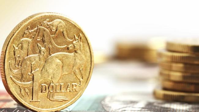 Aussie one dollar coins, on a twenty dollar note.