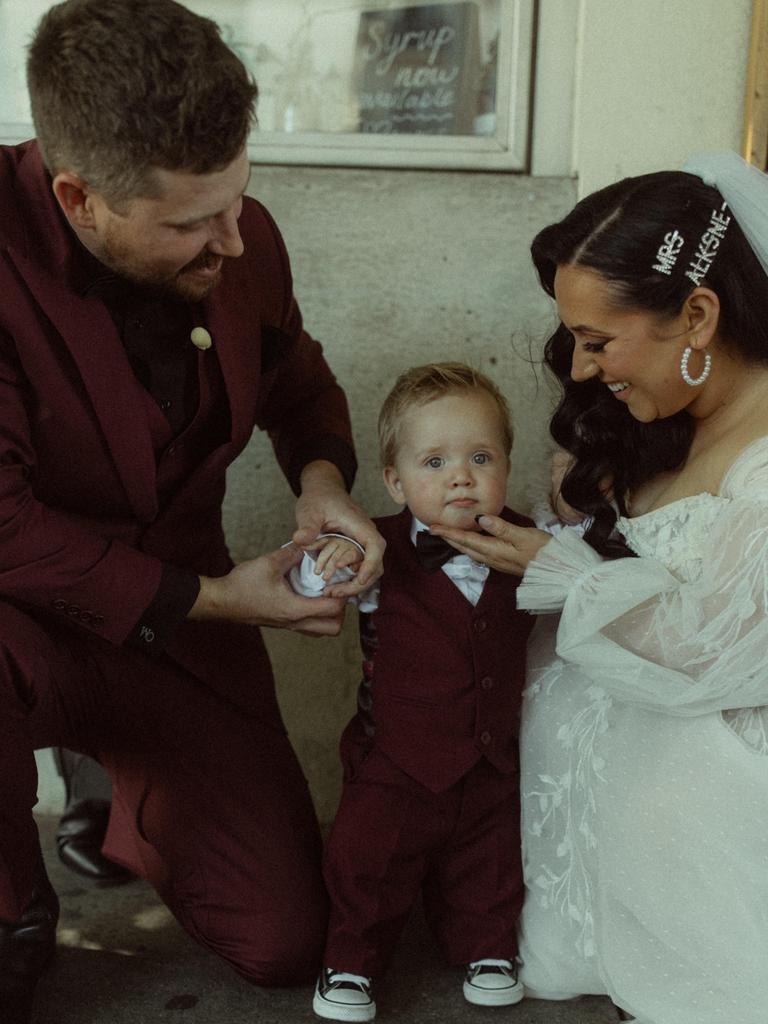 James Alksne and Corey Jones Alksne on their wedding day, with their young son Sterling. Picture: Oh Wild