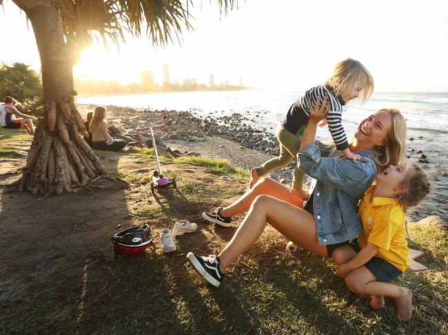 Dutch au pair Kim van der Jooij with Ellie, left, and Sophia at Burleigh Heads on the Gold Coast on Tuesday. Picture: Lyndon Mechielsen