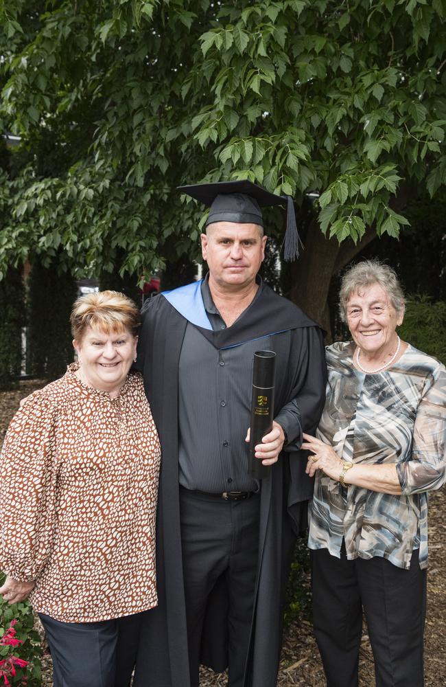 Bachelor of Paramedicine graduate Brett Wilkie with mum Valerie Wilkie (left) and mother-in-law Carmen Simonato at a UniSQ graduation ceremony at Empire Theatres, Tuesday, February 13, 2024. Picture: Kevin Farmer