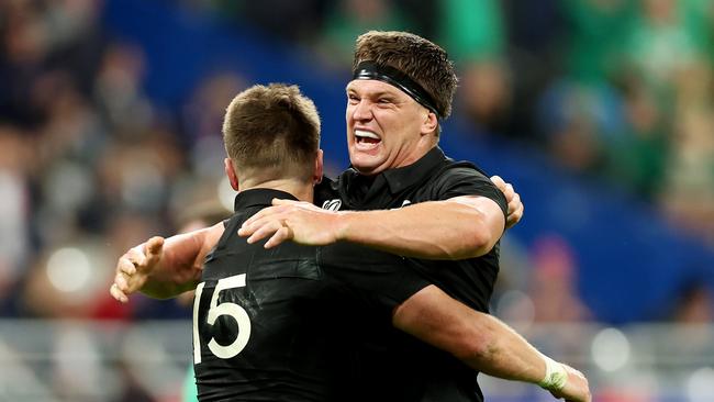 PARIS, FRANCE - OCTOBER 14: Beauden Barrett and Scott Barrett of New Zealand celebrate following the team's victory during the Rugby World Cup France 2023 Quarter Final match between Ireland and New Zealand at Stade de France on October 14, 2023 in Paris, France. (Photo by Chris Hyde/Getty Images)