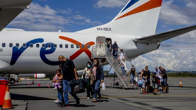 The first Rex Airlines aircraft landing at Gold Coast Airport. Rex has started new twice daily services between the Gold Coast and Melbourne. Passengers exiting the aircraft after arriving on the Gold Coast from Melbourne. Picture: Jerad Williams