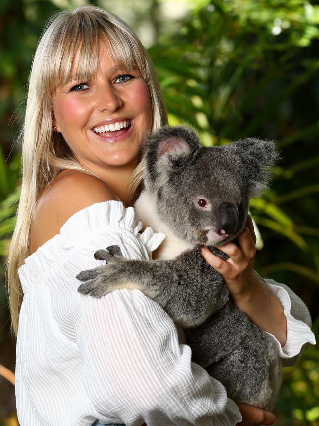 Saturday Disney host Candice Dixon cuddles a koala at Currumbin Wildlife Sanctuary. Picture: Adam Head