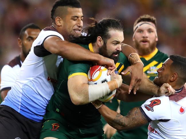 BRISBANE, AUSTRALIA - NOVEMBER 24:  Aaron Woods of the Kangaroos is tackled during the 2017 Rugby League World Cup Semi Final match between the Australian Kangaroos and Fiji at Suncorp Stadium on November 24, 2017 in Brisbane, Australia.  (Photo by Cameron Spencer/Getty Images)