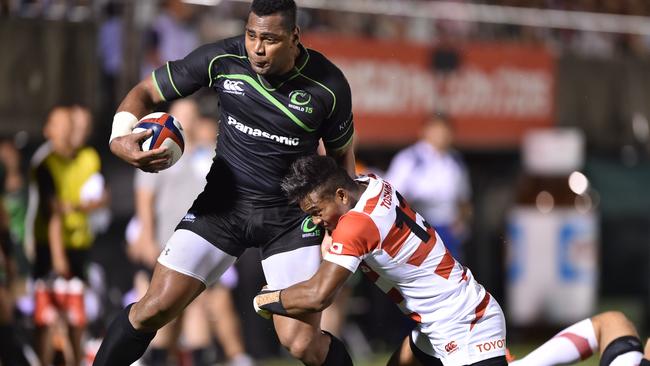 World XV player Taqele Naiyaravoro (L) is tackled by Japan's Kotaro Matsushima (R) during their rugby match at Prince Chichibu Memorial Rugby Ground in Tokyo on August 15, 2015. AFP PHOTO / KAZUHIRO NOGI