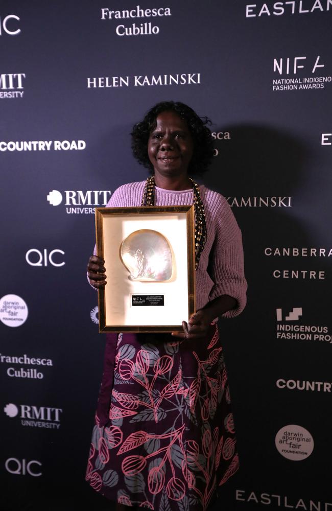 Bábbarra Women's Centre artist Jay Jurrupula Rostron won the Textile Design Award for her first print at the 2024 National Indigenous Fashion Awards on Larrakia Country, Darwin. Picture: Zizi Averill