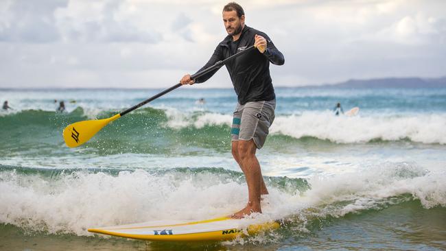 Noosa paddleboard instructor James Howard-Clarke has been hard hit by the loss of tourists since Queensland shut its borders. Picture: Glenn Hunt