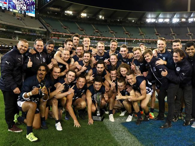 Geelong FNL celebrate with the trophy at the MCG on Saturday. Picture: Mark Dadswell