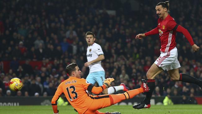 Manchester United's Zlatan Ibrahimovic, right, shoots and scores.