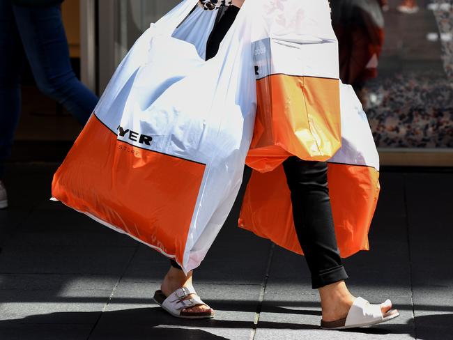 SYDNEY, AUSTRALIA - NewsWire Photos MARCH, 04, 2021: A shopper is seen carrying Myer bags in Pitt St Mall, Sydney. MyerÃs release of its half-yearly results, which were significantly bolstered by JobKeeper subsidies, with total sales down 13.1% year on year to $1.398 million in 26 weeks to January 23, 2021, and comparable sales down 3.1% year on year. Picture: NCA NewsWire/Bianca De Marchi