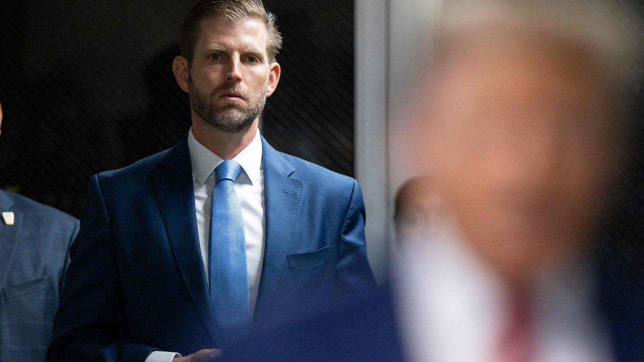 Eric Trump (L), listens as his father former US President Donald Trump speak upon arriving at Manhattan Criminal Court for his trial on April 30, 2024. (Photo by JUSTIN LANE / POOL / AFP)