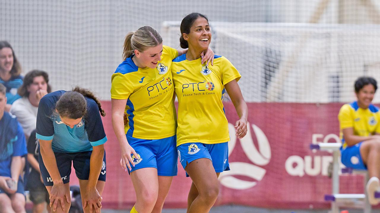 Crusaders women's players celebrate a goal.