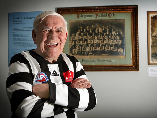 John Wren Exhibition at Champions Australian Racing Museum and Hall of Fame, Federation Square. Collingwood legend Lou Richards beside a framed photo of the Collingwood 1896 Premiership Team.