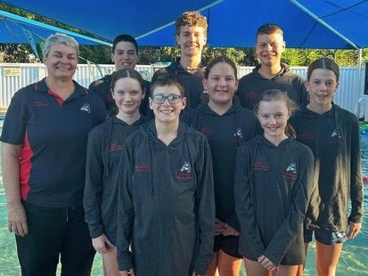 Caribeae head coach Jodie Shanks with swimmers (back row, from left) Levi Thomsen, Spencer Brown, Kallem Humphrey-Travers and (front row) Caroline Davey, Zachary Thomsen, Saidee Whitcombe, Jazmin McLean and Rose Brandon who competed at the Queensland Short Course Championships.