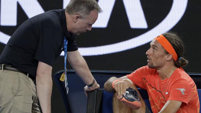 Alexandr Dolgopolov speaks to a tournament referee. Picture: AP Photo