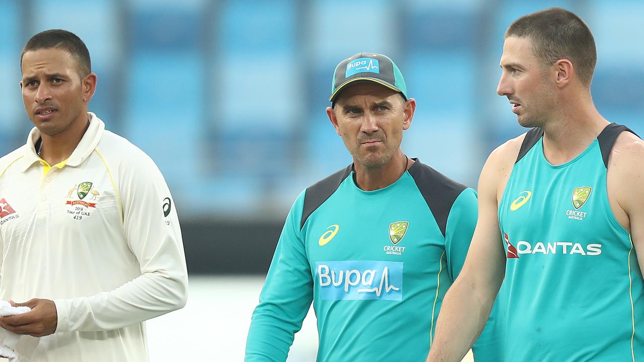 Justin Langer (middle) has found unlikely support from Usman Khawaja (left) as pressure mounts on his job. Picture: Getty Images