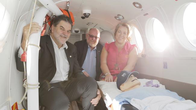 National Health Alliance CEO Mark Diamond, left, Royal Flying Doctor Service of Tasmania CEO John Kirwan and National Rural Health Alliance board chair Tanya Lehmann in the Royal Flying Doctor service simulator. Picture: MATHEW FARRELL