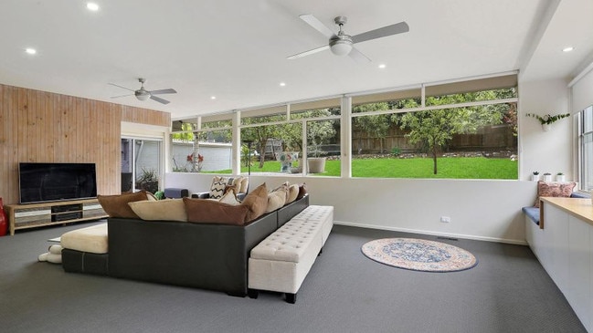 The loungeroom has a full view of the backyard.