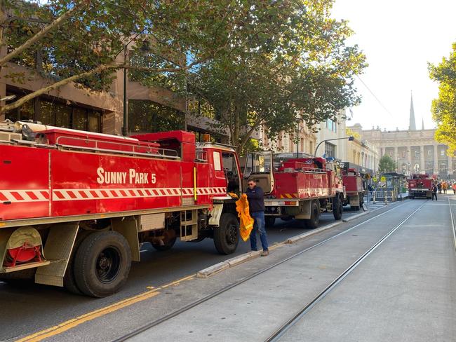 A convoy of CFA trucks makes its way to Victoria's parliament to protest the new emergency services levy. Picture: Regan Hodge