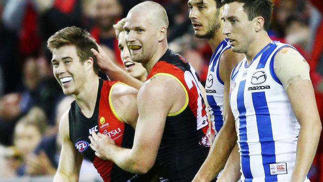 Zach Merrett and Jake Stringer celebrate a goal.