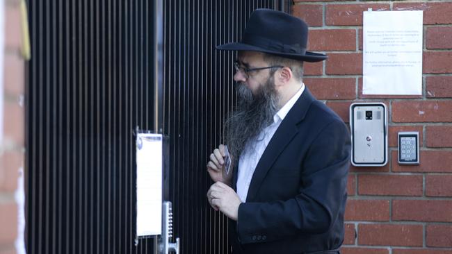 A man arrives at school gate after the closure. Picture: Sarah Matray