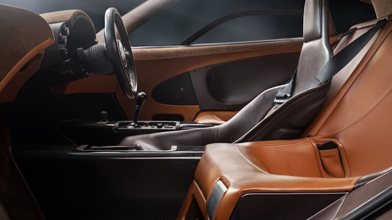 The supercar has a central drivers seat.