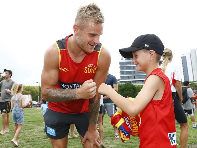 Gold Coast Suns player Brandon Ellis with a fan at Palm Beach. Picture: Tertius Pickard