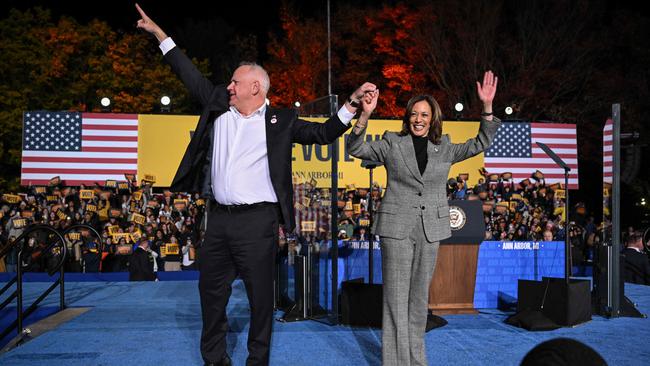 Kamala Harris and her vice presidential running mate Minnesota Governor Tim Walz greet supporters during a campaign rally in Ann Arbor, Michigan, October 28. Picture: Drew Angerer/AFP