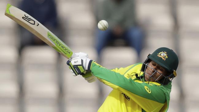 Usman Khawaja hits a four behind during the Cricket World Cup warm-up match between Australia and Sri Lanka. Picture: AP.