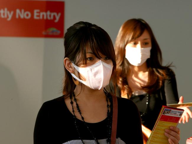 Passengers arriving at Gold Coast Airport during the swine flu outbreak of 2009.