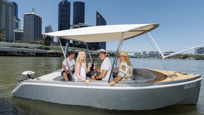 Jada Cerneka, Alberto Ruiz Lopez and Jacara Desland enjoying a cruise on a Go Boat on the Brisbane River. Picture: Lachie Millard