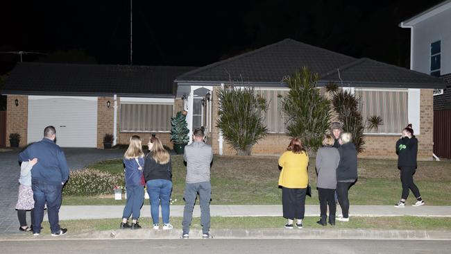 Neighbours attend a vigil in memory of Rita outside the house where Jessica Camilleri killed her mother in July 2019. Picture: Christian Gilles.