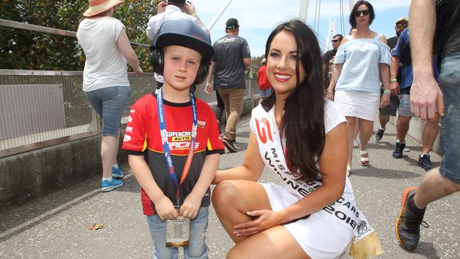 Miss Supercars Gabriella Bottarelli is already impressing the public with Hudson Mikulic, 5, from Ormeau. Picture Mike Batterham