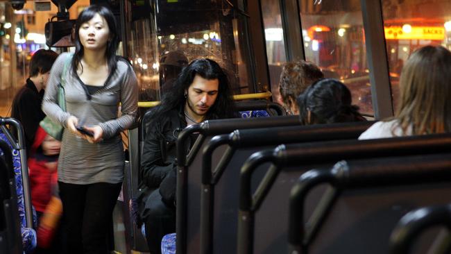 Passengers board the 370 along King St, Newtown.