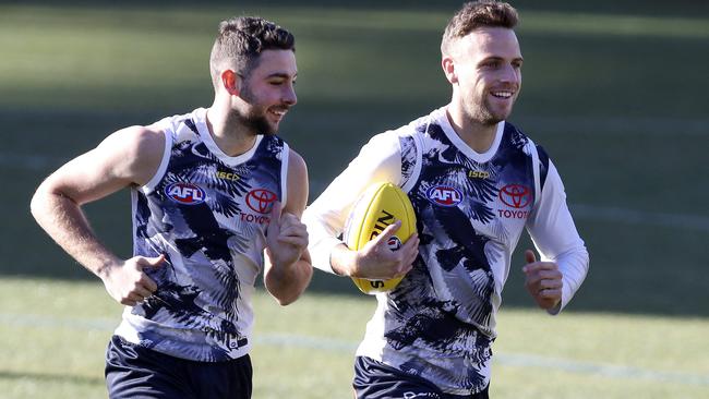 Brodie Smith, right, with teammate Rory Atkins at Crows training.