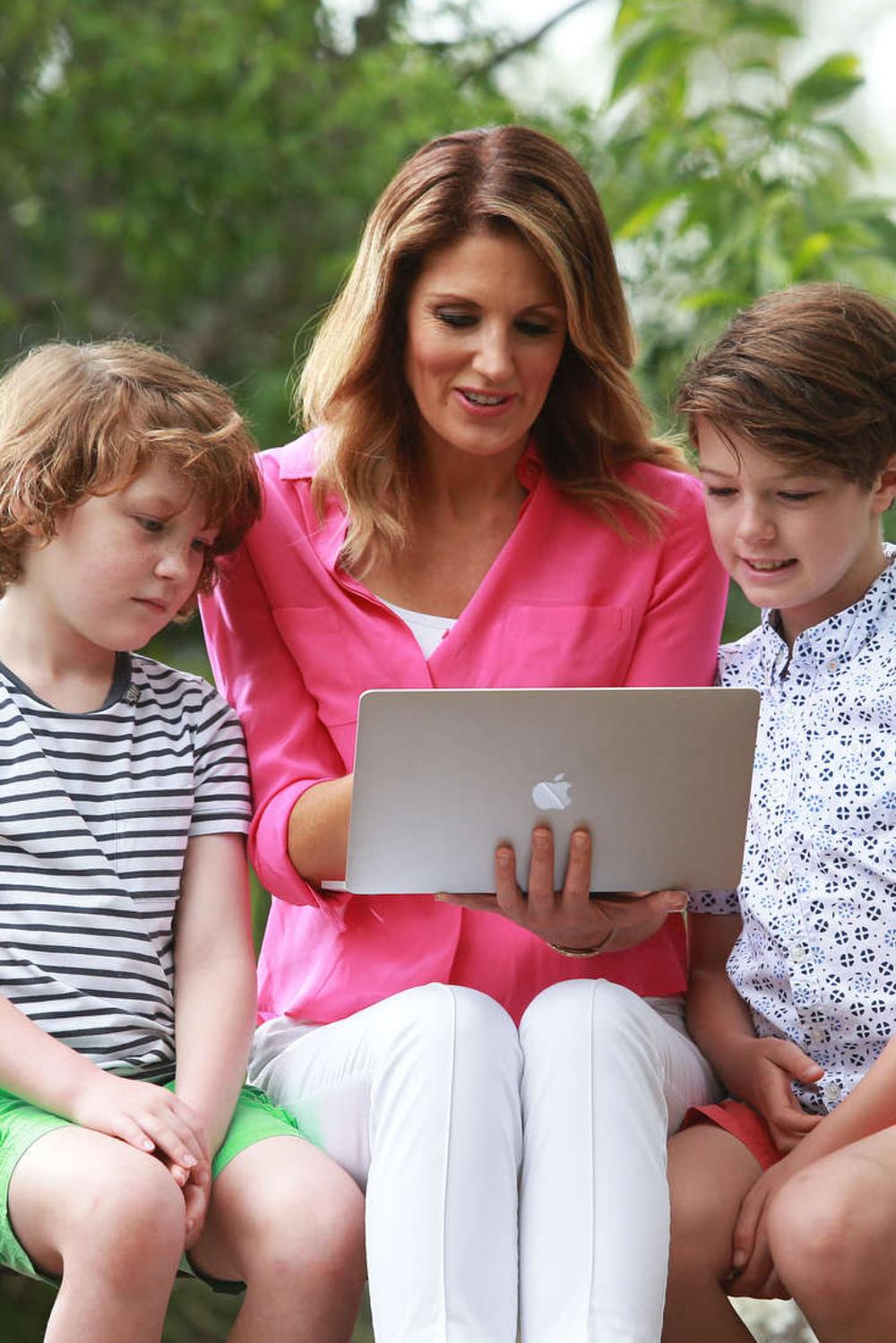 Channel 7 news anchor Sharyn Ghidella with sons Darcy, 7, and Austin, 10. Picture: Claudia Baxter/AAP